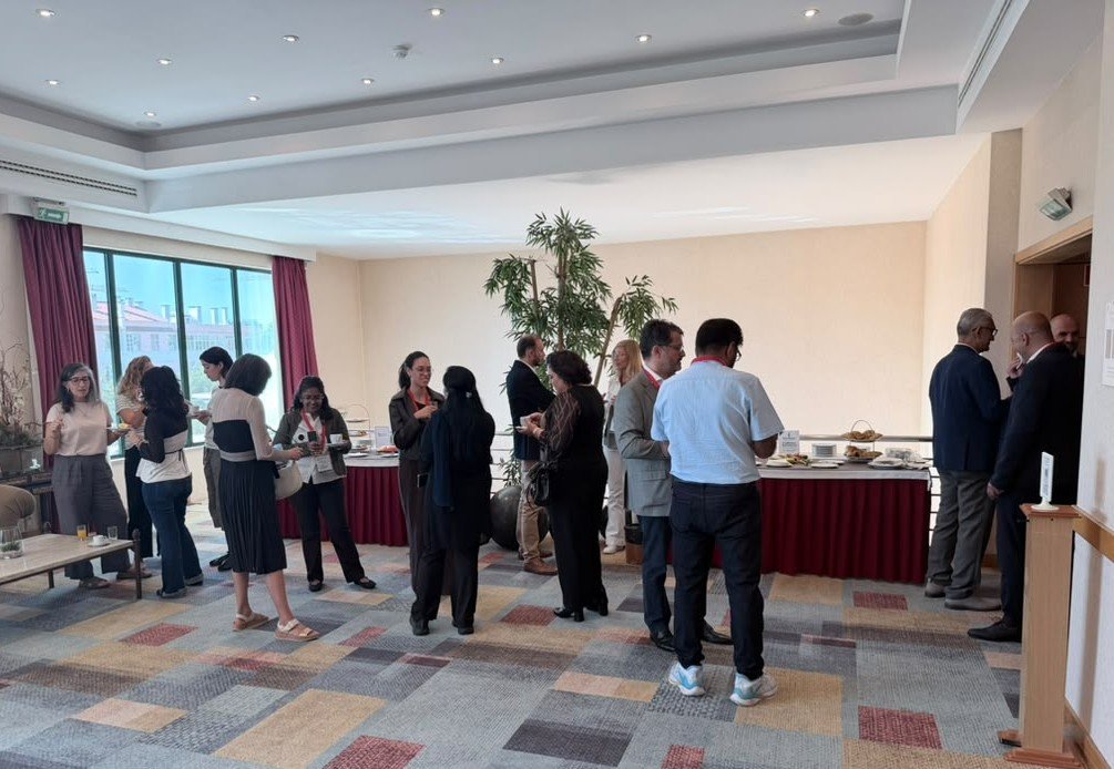 Participants in conversation during a conference break